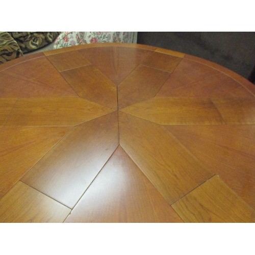 396 - A SUPERB EXPANDING CIRCULAR DINING TABLE AFTER 