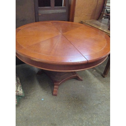 396 - A SUPERB EXPANDING CIRCULAR DINING TABLE AFTER 