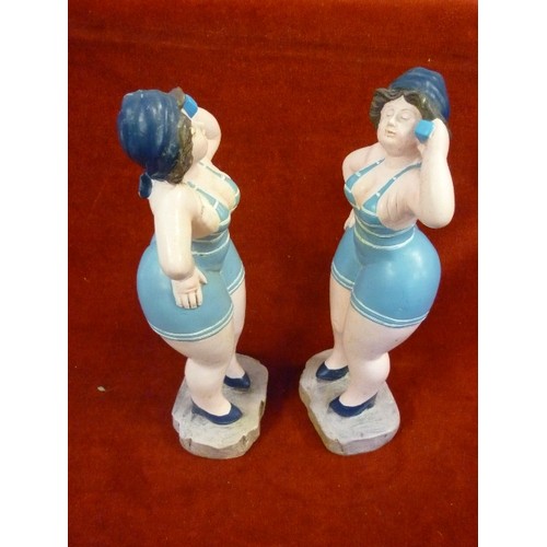 317 - PAIR OF FIGURES OF SUNBATHERS - 31CM