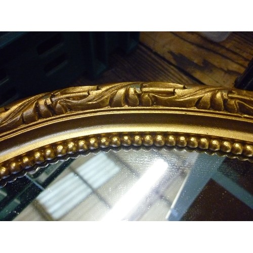 425 - GILT OVAL WALL MIRROR - 63CM X 40CM