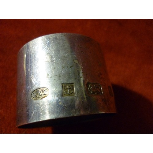 16 - A SILVER NAPKIN RING ENGRAVED 