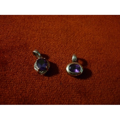 29 - TWO GOOD QUALITY 925 SILVER PENDANTS SET WITH AMETHYST COLOUR STONES