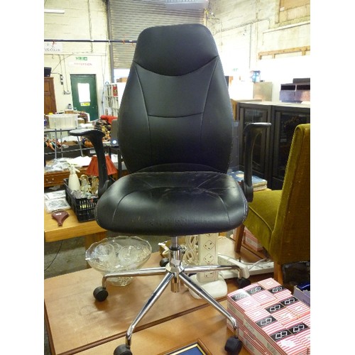 225 - FAUX BLACK LEATHER STAPLES OFFICE CHAIR. SWIVEL AND ADJUSTABLE. WITH CHROME BASE AND CASTERS.