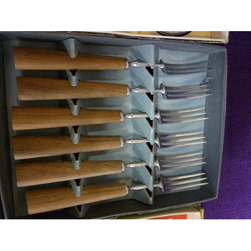 153 - 3 VINTAGE BOXES OF CUTLERY. A FISH SET, A FRUIT SET, AND SOME WOODEN HANDLED FORKS.