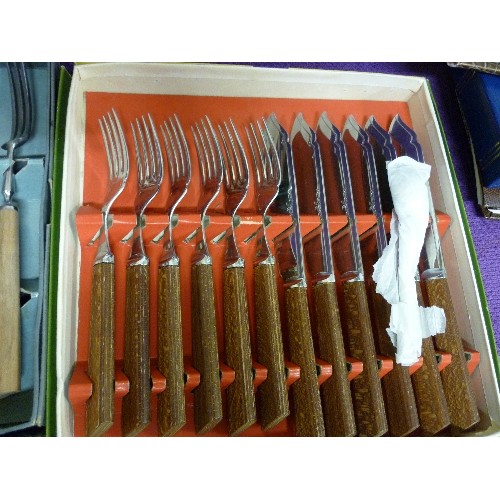 153 - 3 VINTAGE BOXES OF CUTLERY. A FISH SET, A FRUIT SET, AND SOME WOODEN HANDLED FORKS.