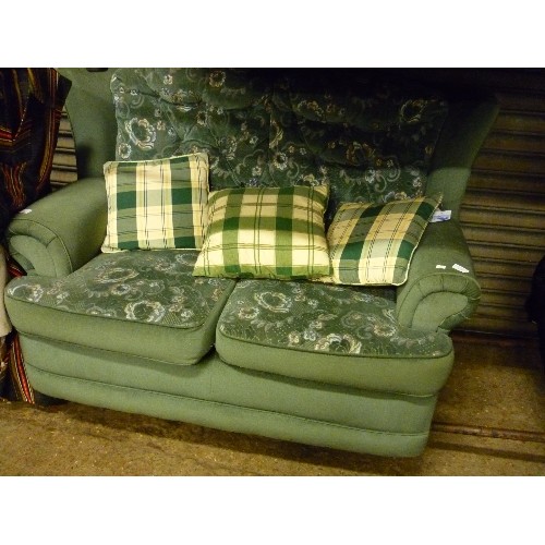 449 - SMALL MID-GREEN RETRO DRALON SOFA. FLORAL PATTERNED CUSHIONS AND BUTTON-BACK.