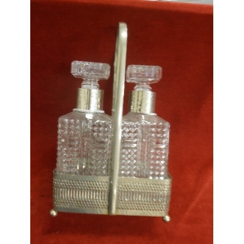 95 - PAIR OF PRESSED GLASS SPIRIT DECANTERS IN PLATED STAND WITH GIN  AND WHISKY LABELS