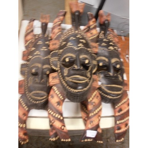 144 - 3 X CARVED WOODEN AFRICAN MASKS/ WALL-ART. APPROX 63CM H.