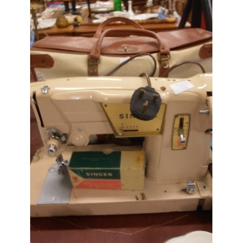 171 - RETRO SINGER SEWING ELECTRIC MACHINE, IN A FAB MUSHROOM COLOUR. HAS ORIGINAL CARRY BAG.