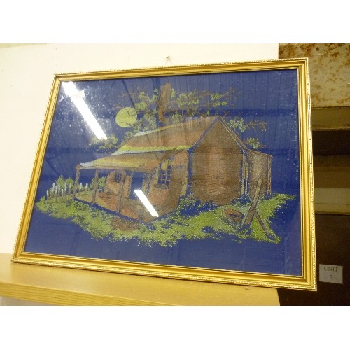 370 - LARGE GILT-FRAMED 'VELVET ART' PICTURE OF A SIMPLE SHACK, ON ROYAL BLUE BACKGROUND.