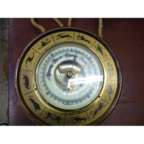 169 - SMALL BAROMETER. FEATURES ZODIAC SIGNS. CIRCULAR & WALL HANGING.