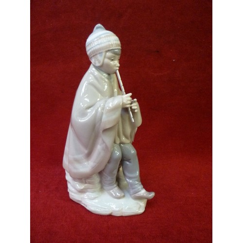 12 - A LLADRO NAO PORCELAIN FIGURE OF A FLUTE PLAYER WITH METAL FLUTE - 25CM