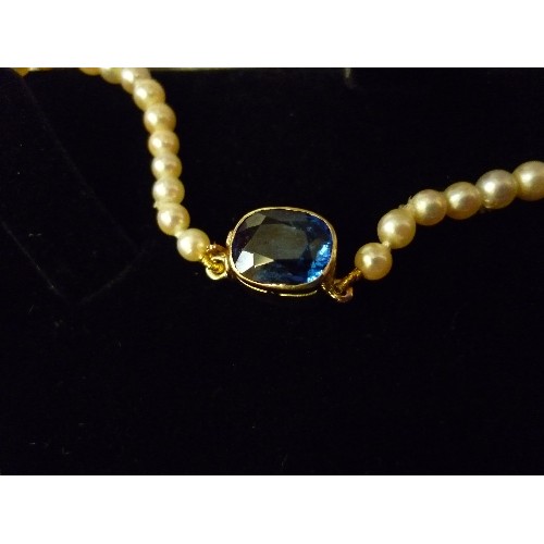 64 - AN ELEGANT GRADUATED PEARL NECKLACE, THE GOLD (UNTESTED) CLASP SET WITH A CUSHION CUT SAPPHIRE - 40C... 