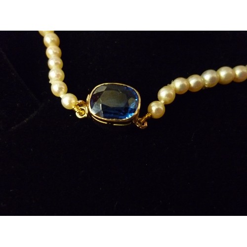 64 - AN ELEGANT GRADUATED PEARL NECKLACE, THE GOLD (UNTESTED) CLASP SET WITH A CUSHION CUT SAPPHIRE - 40C... 