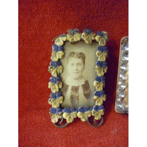 60 - TWO MINIATURE VICTORIAN PHOTOGRAPH FRAMES, ONE IN  BRASS WITH ENAMEL PANSY SURROUND, THE OTHER IN FA... 