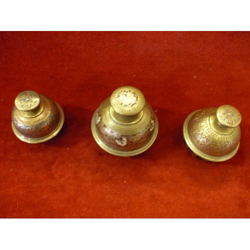 89 - THREE EARLY 20TH CENTURY INDIAN BENARES BRASS ELEPHANT BELLS - GRADUATED SIZES - THE LARGEST 11CM