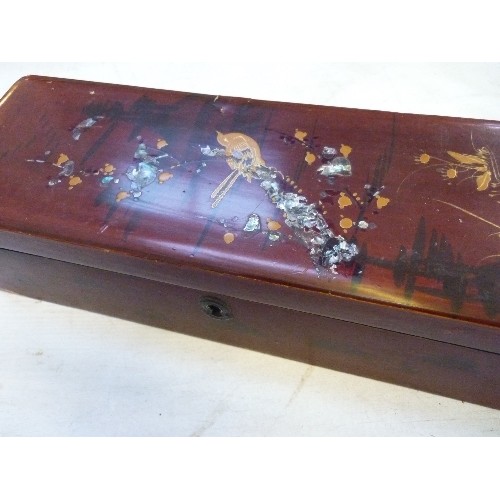 53A - AN EDWARDIAN ORIENTAL LACQUERED GLOVE BOX, THE LID DECORATED WITH A BIRD AND MOTHER OF PEARL DESIGN.... 