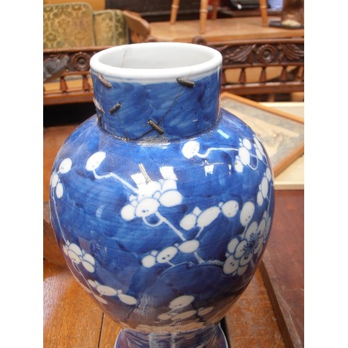 165 - A LARGE 19TH CENTURY CHINESE BLUE AND WHITE BALUSTER SHAPED PRUNUS VASE WITH KANGXI FOUR CHARACTER M... 