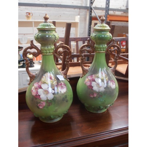 224 - A PAIR OF LATE VICTORIAN VERY LARGE EARTHENWARE VASES IN GREEN WITH PANELS OF ROSES AND WITH GILT HA... 