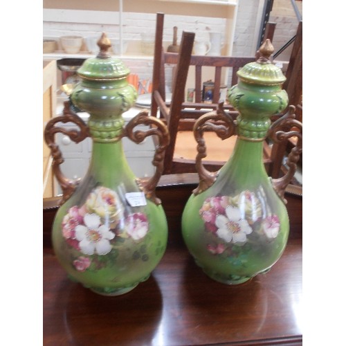 224 - A PAIR OF LATE VICTORIAN VERY LARGE EARTHENWARE VASES IN GREEN WITH PANELS OF ROSES AND WITH GILT HA... 