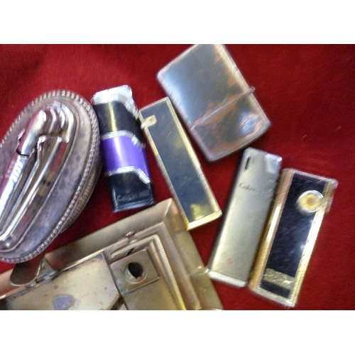 101 - BRASS MATCHBOX HOLDER, CIGAR CUTTER AND ASHTRAY TOGETHER WITH SIX LIGHTERS  INCLUDING A RONSON  TABL... 