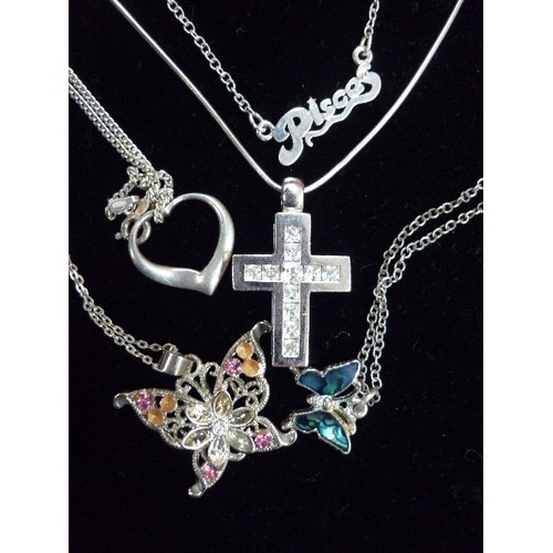 81G - 5 X 925 SILVER AND SILVER TONE NECKLACES, WITH CROSS PENDANTS, BUTTERFLIES ETC, 3 OF THEM MARKED 925... 