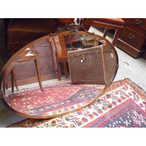 433 - A 1930'S OVAL WALL MIRROR WITH CLASSICAL URN & SWAG DESIGN - COPPER FINISH - BEVELLED GLASS