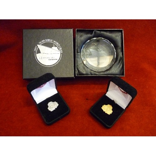 100 - CUNARD QE2 SILVER JUBILEE CRUISE GLASS PAPERWEIGHT. TOGETHER WITH 2 CUNARD PIN BADGES. ALL BOXED.