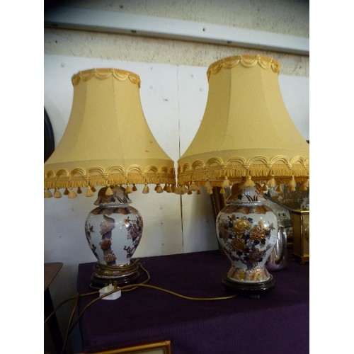 120 - A PAIR OF ATTRACTIVE 'GINGER-JAR' STYLE LAMP BASES. ORIENTAL PATTERN, AND PALE GOLD SHADES.