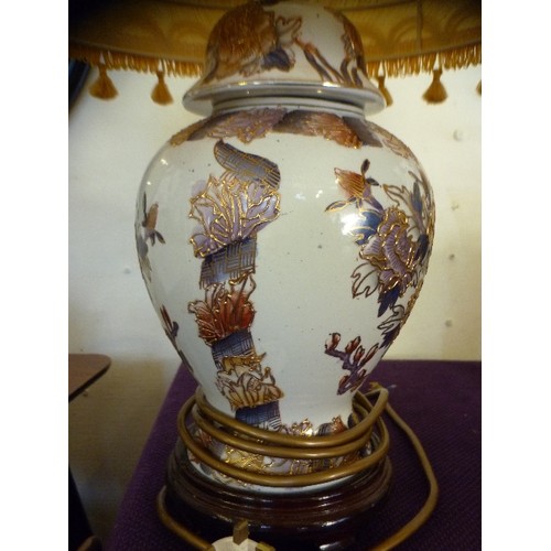 120 - A PAIR OF ATTRACTIVE 'GINGER-JAR' STYLE LAMP BASES. ORIENTAL PATTERN, AND PALE GOLD SHADES.