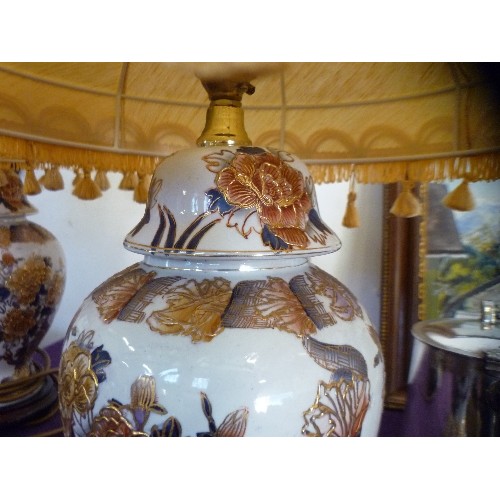 120 - A PAIR OF ATTRACTIVE 'GINGER-JAR' STYLE LAMP BASES. ORIENTAL PATTERN, AND PALE GOLD SHADES.