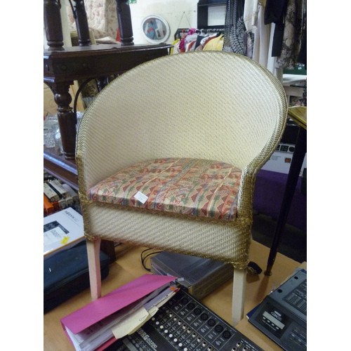 216 - CREAM/GOLD PAINTED LLOYD LOOM STYLE BEDROOM CHAIR. PADDED SEAT. WIDER THAN SOME.