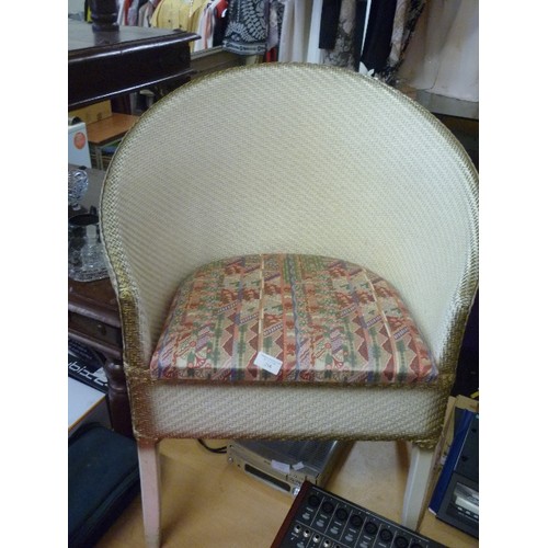 216 - CREAM/GOLD PAINTED LLOYD LOOM STYLE BEDROOM CHAIR. PADDED SEAT. WIDER THAN SOME.