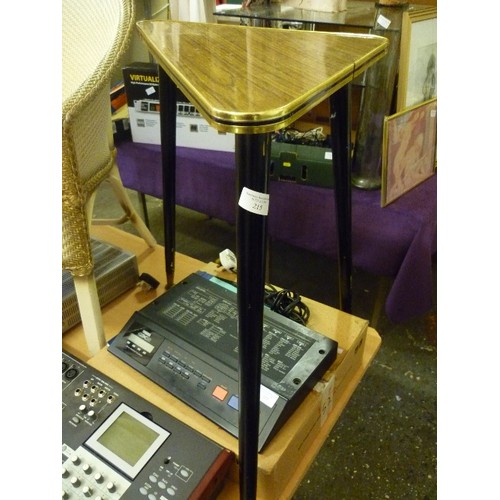 215 - RETRO TRIANGULAR TOPPED 3-LEGGED SIDE TABLE. WOOD-EFFECT FORMICA TOP, GOLD EDGED. BLACK TAPERED LEGS... 