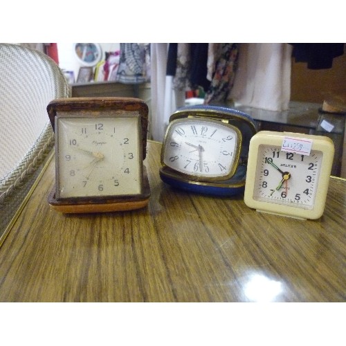 214 - 3 VINTAGE COMPACT TRAVEL CLOCKS. 'OLYMPIC, EUROPA, AND DELUXE'