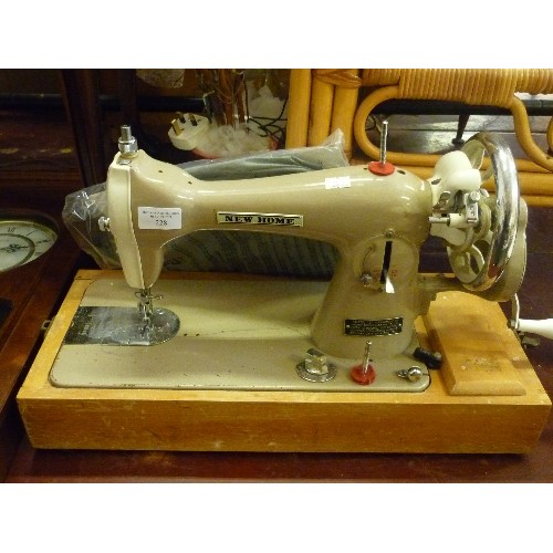 228 - VINTAGE RETRO ELECTRIC 'NEW-HOME 121' SEWING MACHINE. MANUFACTURED BY JANOME-JAPAN, TO THE SPECIFICA... 