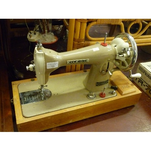 228 - VINTAGE RETRO ELECTRIC 'NEW-HOME 121' SEWING MACHINE. MANUFACTURED BY JANOME-JAPAN, TO THE SPECIFICA... 