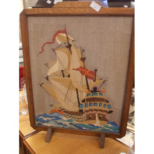 300 - LOVELY VINTAGE FIRE-SCREEN. WOODEN FRAMED CROSS-STITCH OF A GALLEON.