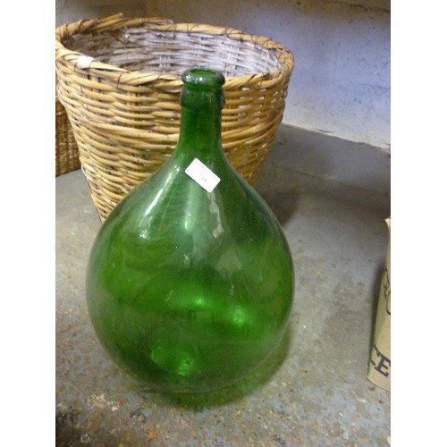 148 - LARGE VINTAGE GREEN FRENCH DEMIJOHN, IN WICKER BASKET.