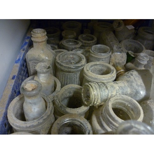 195 - LARGE QUANTITY OF VINTAGE GLASS BOTTLES AND JARS. INTERESTING SHAPES, TOGETHER WITH LOTS OF DUST!