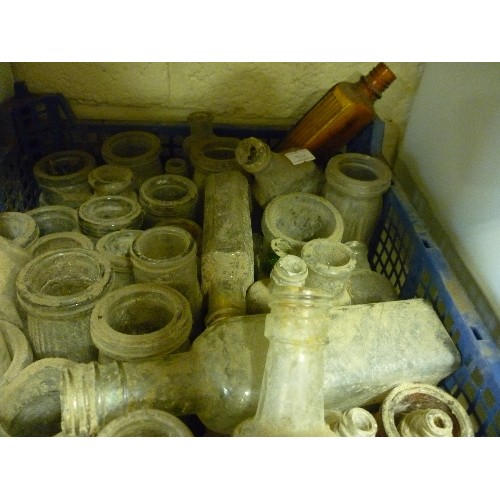 195 - LARGE QUANTITY OF VINTAGE GLASS BOTTLES AND JARS. INTERESTING SHAPES, TOGETHER WITH LOTS OF DUST!