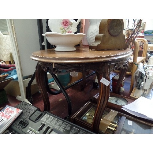 237 - OVAL COFFEE TABLE, WITH ATTRACTIVE CARVED FRAME AND LEGS.