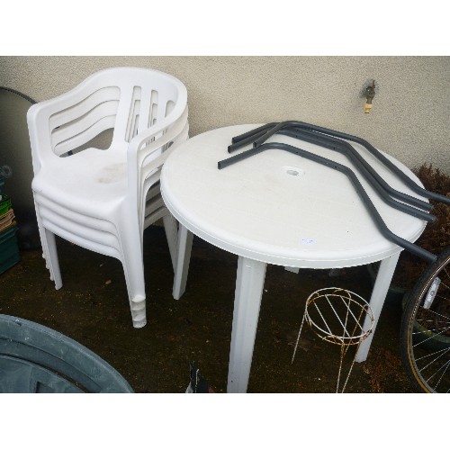 634 - WHITE PLASTIC GARDEN TABLE AND 4 CHAIRS