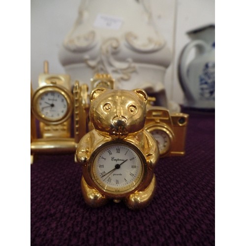 84 - COLLECTION OF 8 GILT MINIATURE NOVELTY CLOCKS - POST BOX, TELEPHONE CAMERA, DRUM KIT ETC