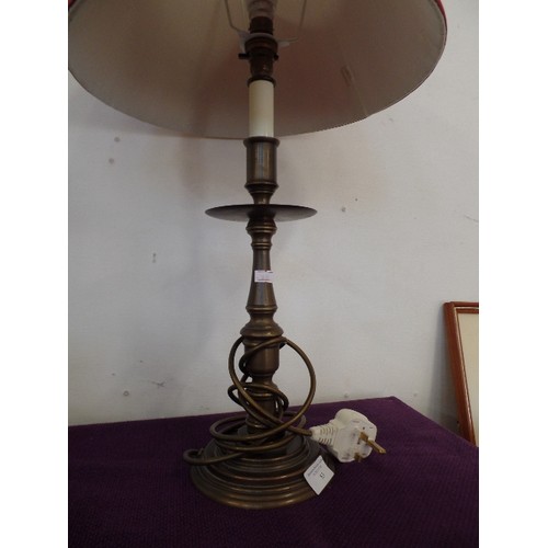 83 - A BRONZE  EFFECT TABLE LAMP WITH PLEATED RED SHADE