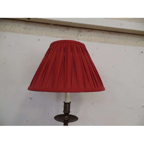 83 - A BRONZE  EFFECT TABLE LAMP WITH PLEATED RED SHADE