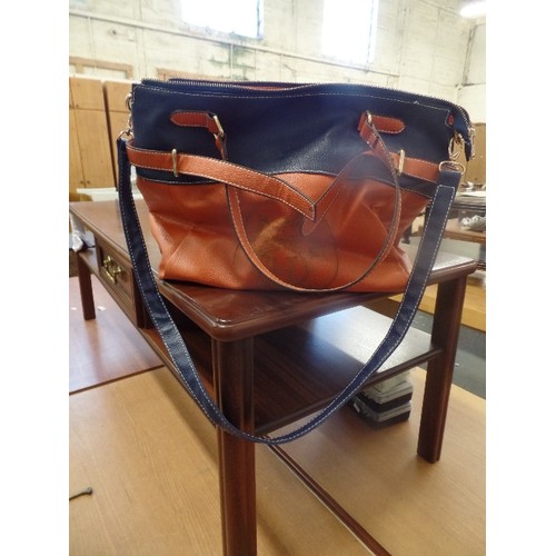 64 - A BLUE AND TAN TOTE BAG WITH HERMES LOGO