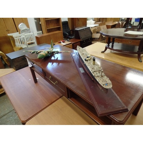 56 - MODEL PLASTIC PROPELLOR PLANE AND A LARGE MODEL OF THE TITANIC ON A WOODEN PLINTH