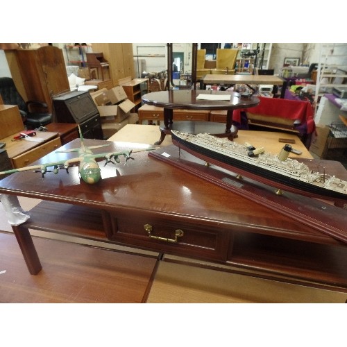 56 - MODEL PLASTIC PROPELLOR PLANE AND A LARGE MODEL OF THE TITANIC ON A WOODEN PLINTH