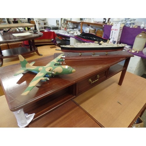 56 - MODEL PLASTIC PROPELLOR PLANE AND A LARGE MODEL OF THE TITANIC ON A WOODEN PLINTH